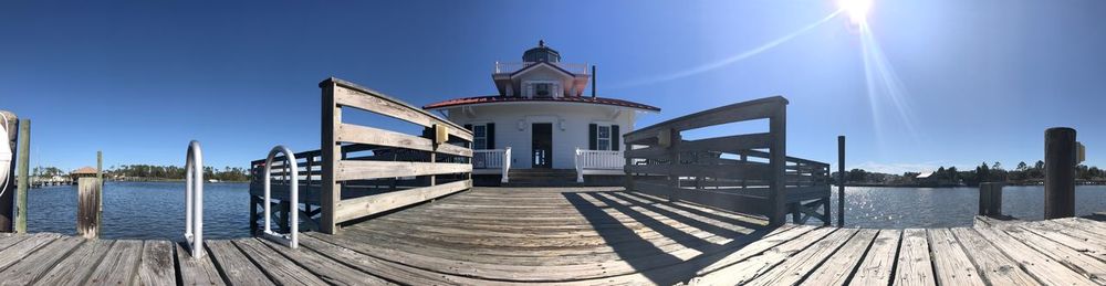 View of pier against clear blue sky