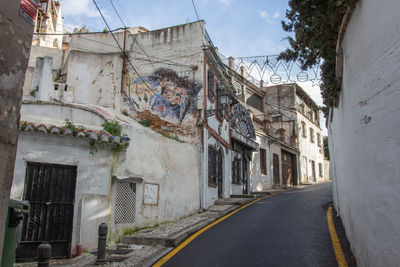 Road amidst buildings in town