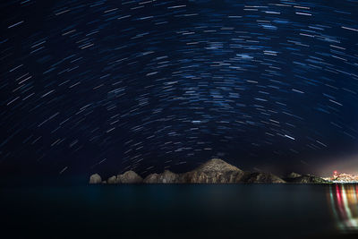 Scenic view of sea against sky at night