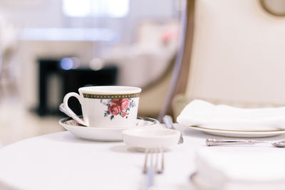 Close-up of coffee cup on table