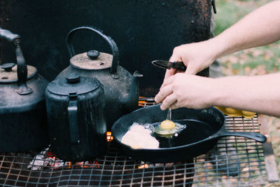 Close-up of man preparing food