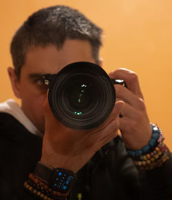 Close-up of woman photographing with camera