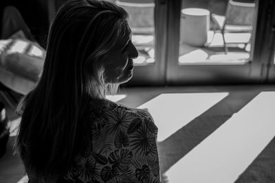 Portrait of bride to be looking at her wedding bouquet 