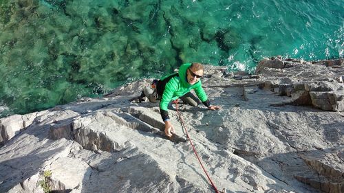 High angle view of man mountain climbing