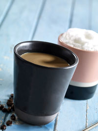 Close-up of coffee cup on table