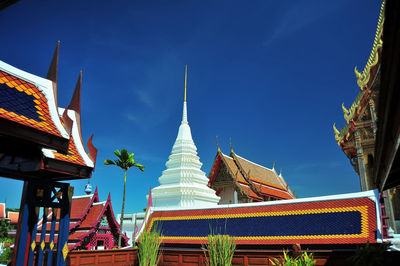 Low angle view of pagoda against buildings