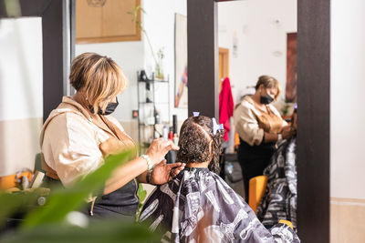 Female barber cutting hair