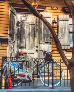 Bicycle against building in city