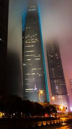 Low angle view of modern building at night