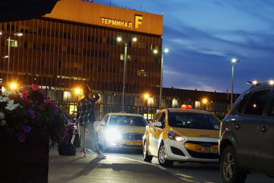 Cars on road in city at night