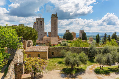 Courtyard of the ancient fortress ruin in the city of san gimignano in italy