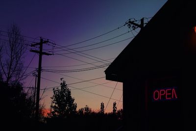 Low angle view of silhouette trees against sky during sunset
