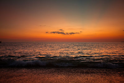 Scenic view of sea against romantic sky at sunset