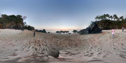 Scenic view of beach against clear sky