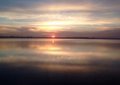 Scenic view of lake at sunset