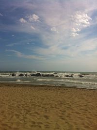 Scenic view of beach against sky