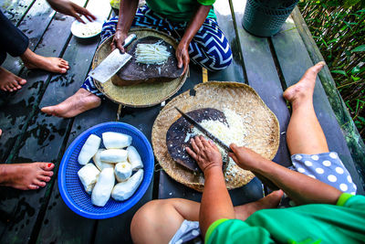 Low section of people holding food