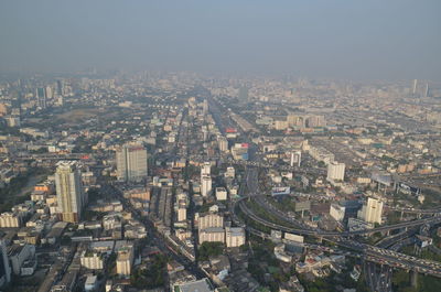 High angle view of city buildings against sky