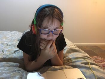 Close-up of girl in bed at home