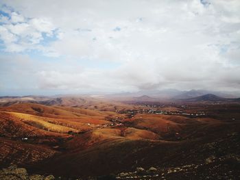 High angle view of land against cloudy sky