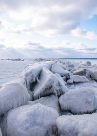 Scenic view of frozen lake against sky