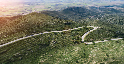 High angle view of winding road on landscape