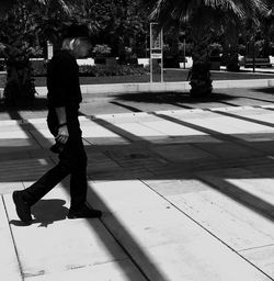Full length of a man walking on road