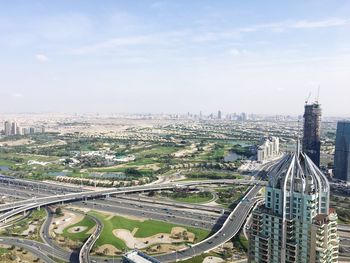 High angle view of buildings in city against sky