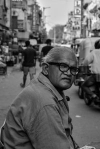 Portrait of man standing on street