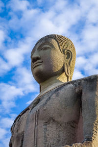 Low angle view of statue against sky