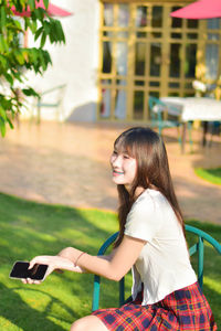 Young woman using mobile phone