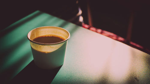 Close-up of coffee cup on table