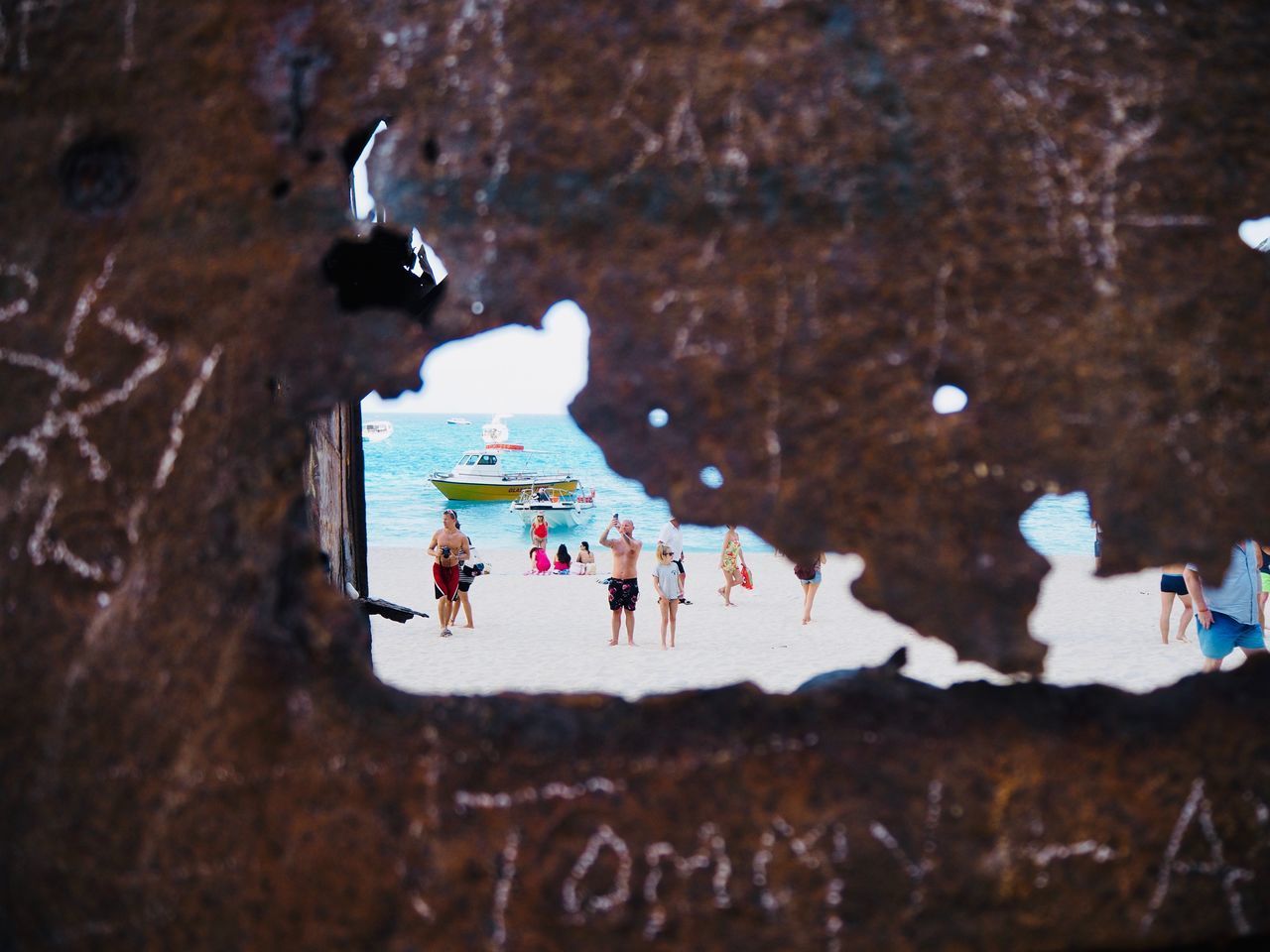 HIGH ANGLE VIEW OF PEOPLE IN FRONT OF BUILDING