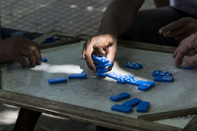 High angle view of man playing with toy on table