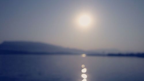 Close-up of water against sky at sunset