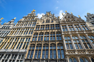 Low angle view of building against blue sky