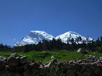 Scenic view of mountains against cloudy sky