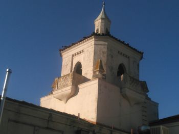 Low angle view of church against blue sky