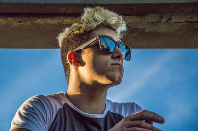 Portrait of young man wearing sunglasses