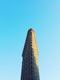 Low angle view of tower against clear blue sky