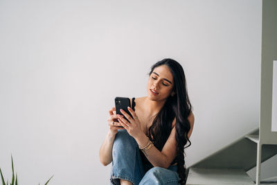 Young woman using mobile phone