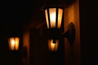 Low angle view of lit wall lamps