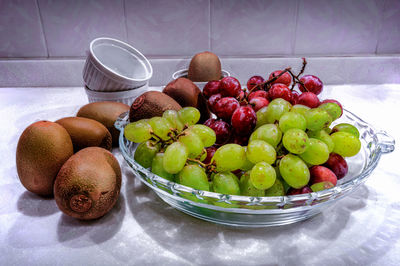 Fruits in bowl on table