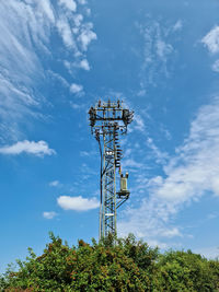 Close up view on a big power pylon transporting electricity in a countryside area in europe