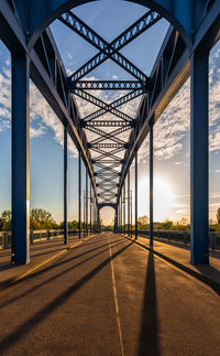 Bridge over river at sunset