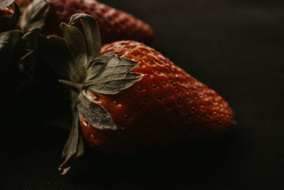 Close-up of red berries on black background