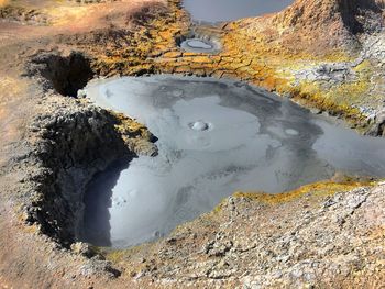 High angle view of lake amidst rocks