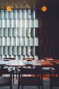 Empty chairs and tables in restaurant