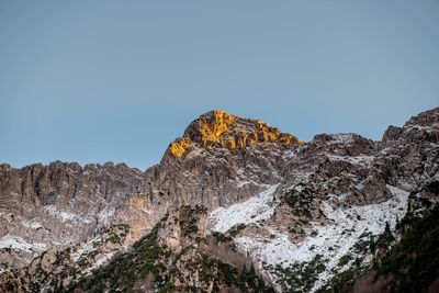 Low angle view of rocks against sky