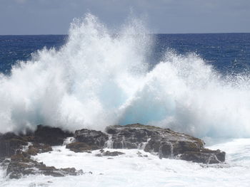 Waves splashing on rocks